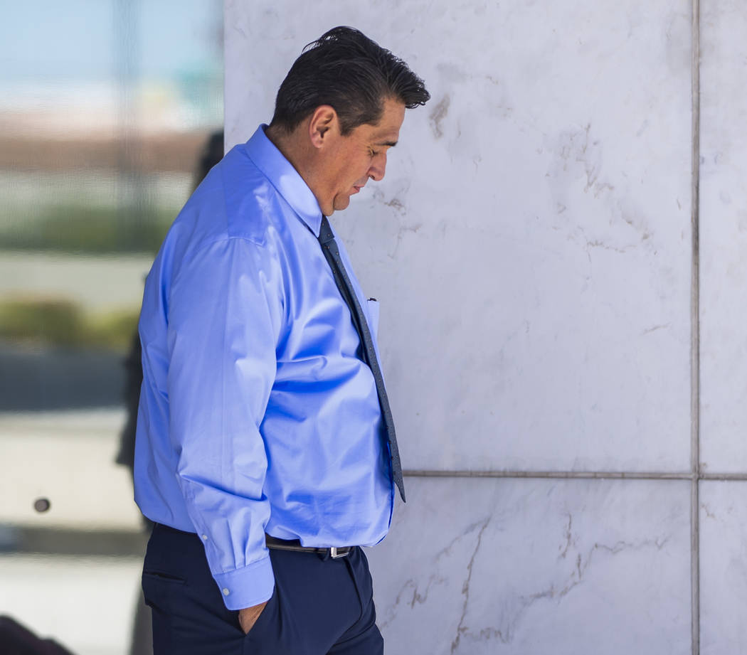 Defendant Bradley Campos departs the Lloyd D. George Courthouse following opening statements in ...