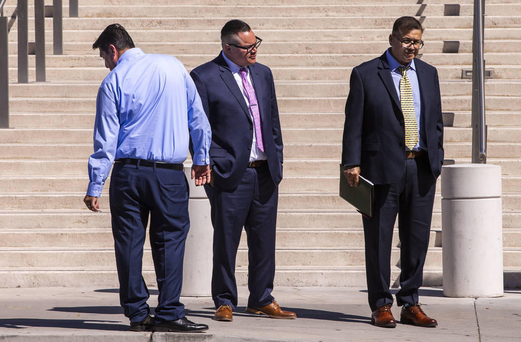 Defendants Bradley Campos, left, Diego Garcia and Cesar Morales depart the Lloyd D. George Cour ...