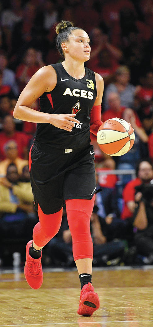 Las Vegas Aces guard Kayla McBride dribbles the ball during the second half of Game 1 of a WNBA ...