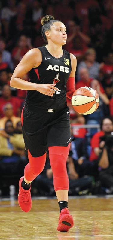 Las Vegas Aces guard Kayla McBride dribbles the ball during the second half of Game 1 of a WNBA ...