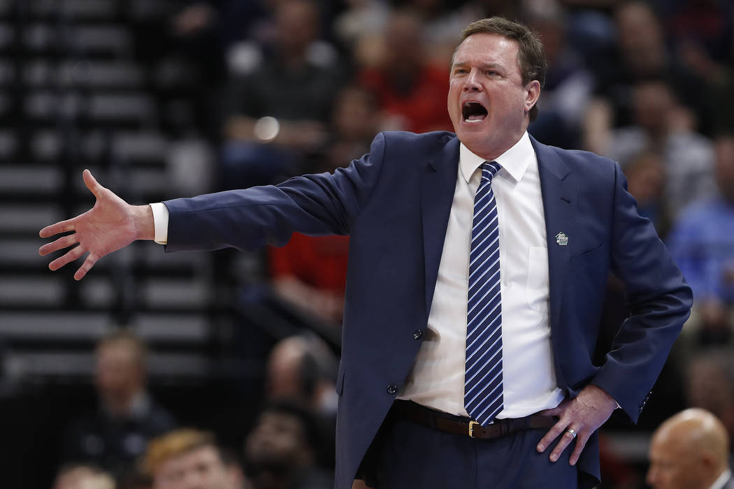 FILE - In this March 21, 2019, file photo, Kansas head coach Bill Self reacts in the first half ...