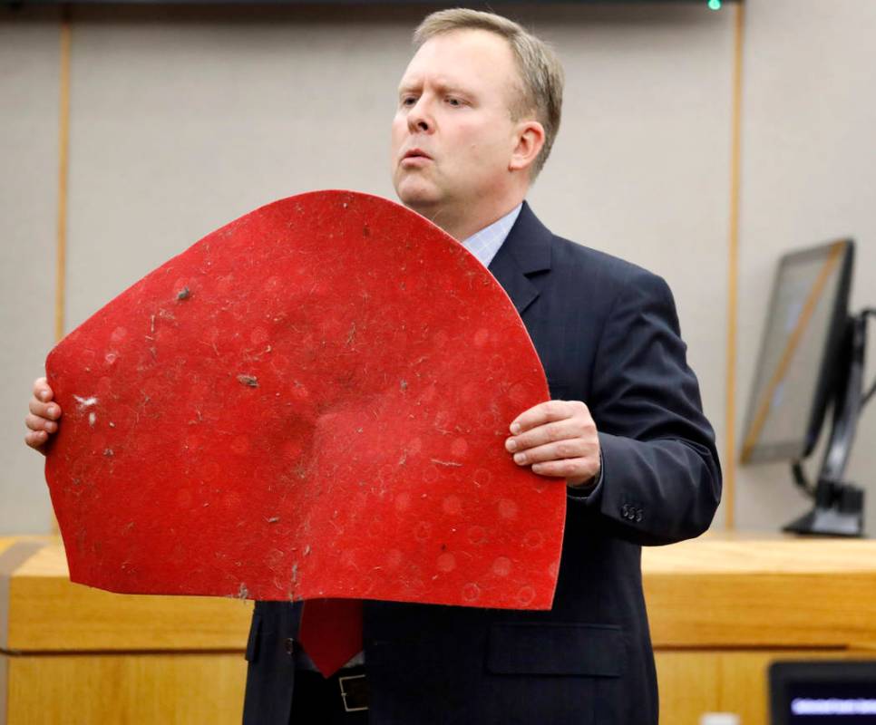 Assistant District Attorney Jason Hermus shows Botham Jean's doormat to the jury during his ope ...