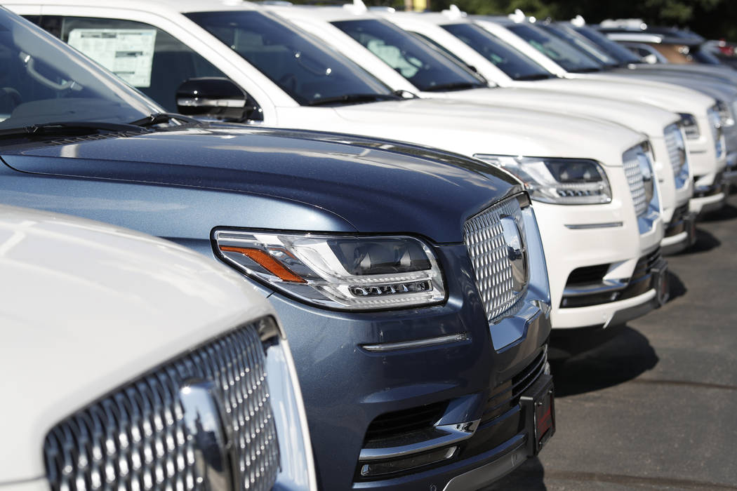 In a July 28, 2019, file photo unsold 2019 Lincoln Navigators sit at a dealership in Englewood, ...