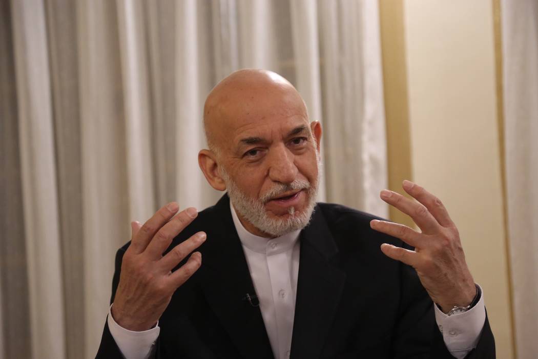 Former Afghan President Hamid Karzai speaks during an interview in Kabul, Afghanistan, Tuesday, ...