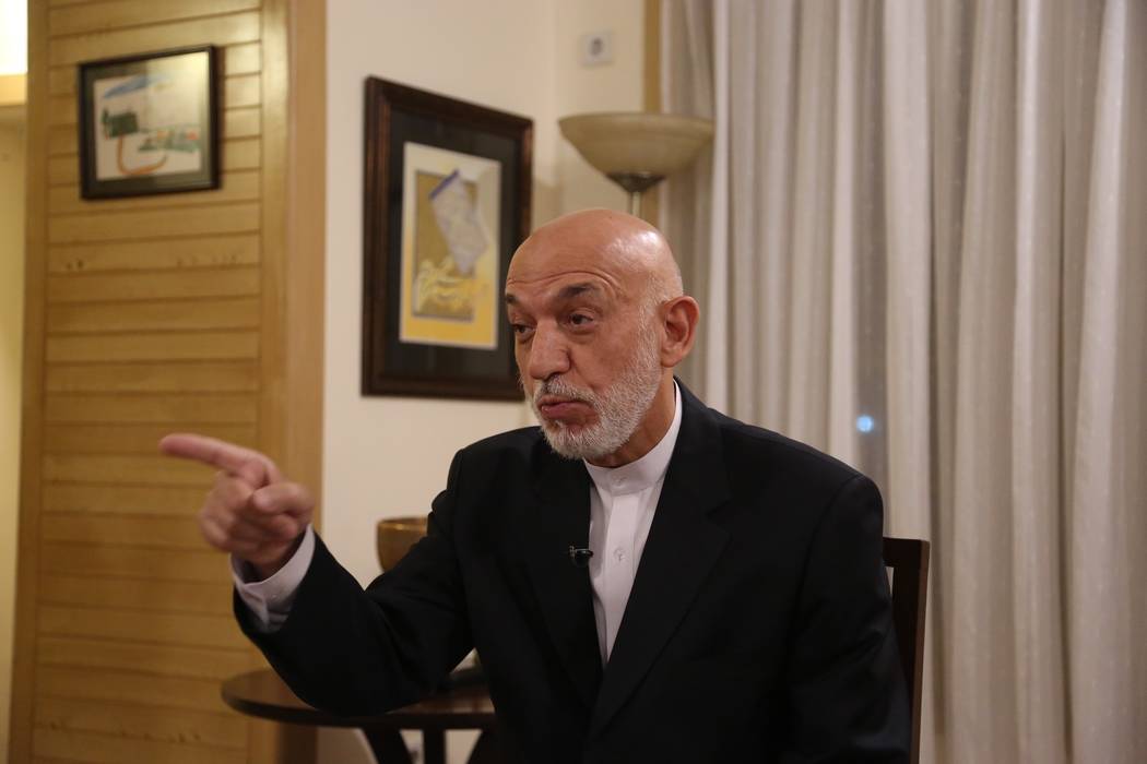 Former Afghan President Hamid Karzai speaks during an interview in Kabul, Afghanistan, Tuesday, ...