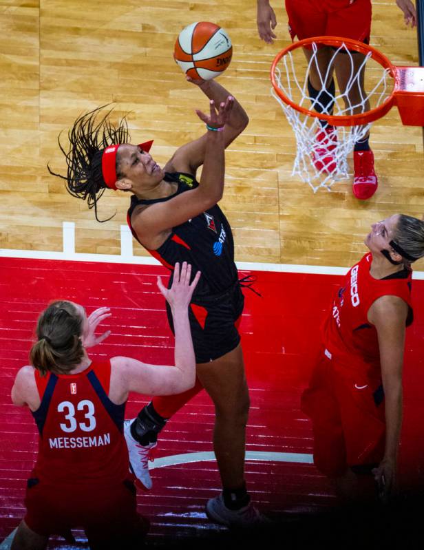 Las Vegas Aces center A'ja Wilson (22, right) looks to the basket over Washington Mystics cente ...