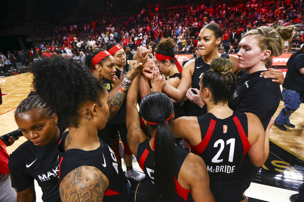 Members of the Las Vegas Aces huddle after losing to the Washington Mystics in a WNBA semifinal ...