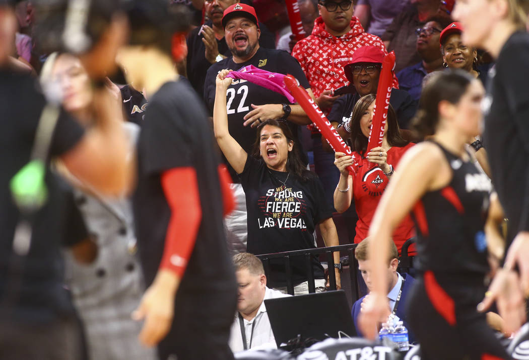 Las Vegas Aces fans react at the end of the first quarter of a WNBA semifinal basketball game a ...