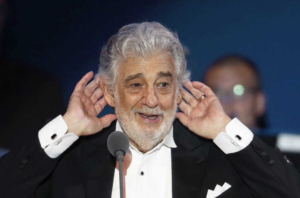 FILE - In this Aug. 28, 2019 file photo, opera star Placido Domingo listens to applause at the ...