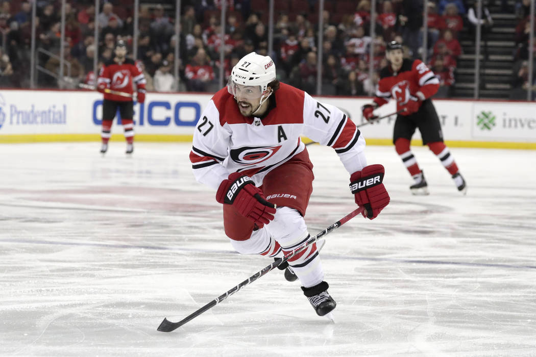 FILE - In this Feb. 10, 2019, file photo, Carolina Hurricanes defenseman Justin Faulk (27) is s ...