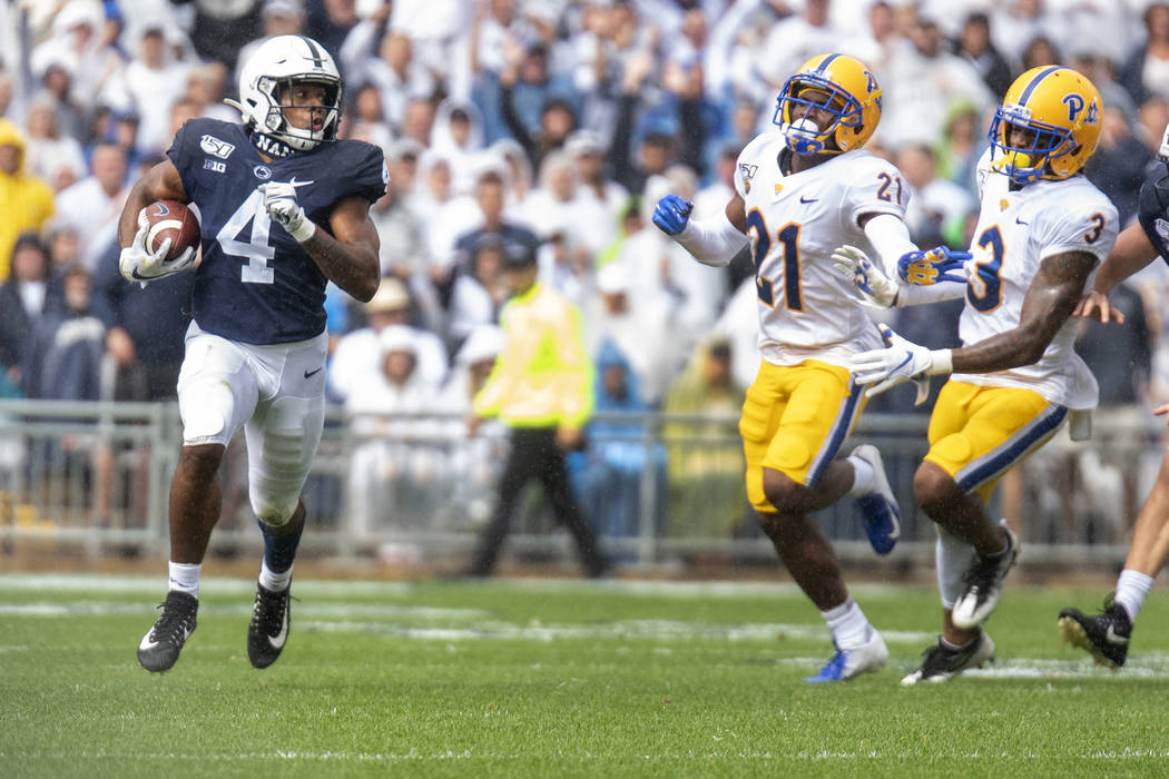 Penn State running back Journey Brown (4) breaks away on a long run in the first quarter of an ...