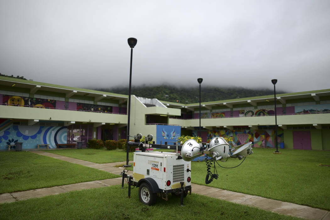 A portable light pole sits parked in a courtyard of Ramon Quinones Medina High School, where re ...