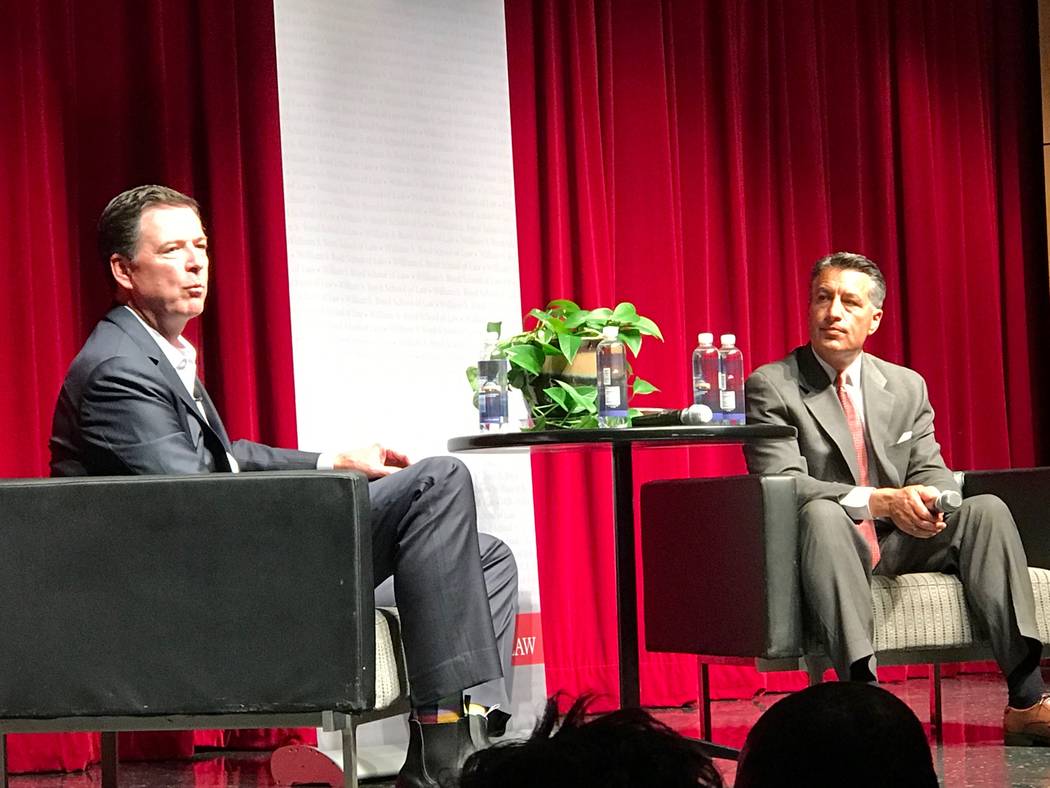 Former FBI Director James Comey answers questions from former Nevada Gov. Brian Sandoval at a W ...