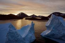 An Aug. 16, 2019, file photo shows large Icebergs floating as the sun rises near Kulusuk, Green ...