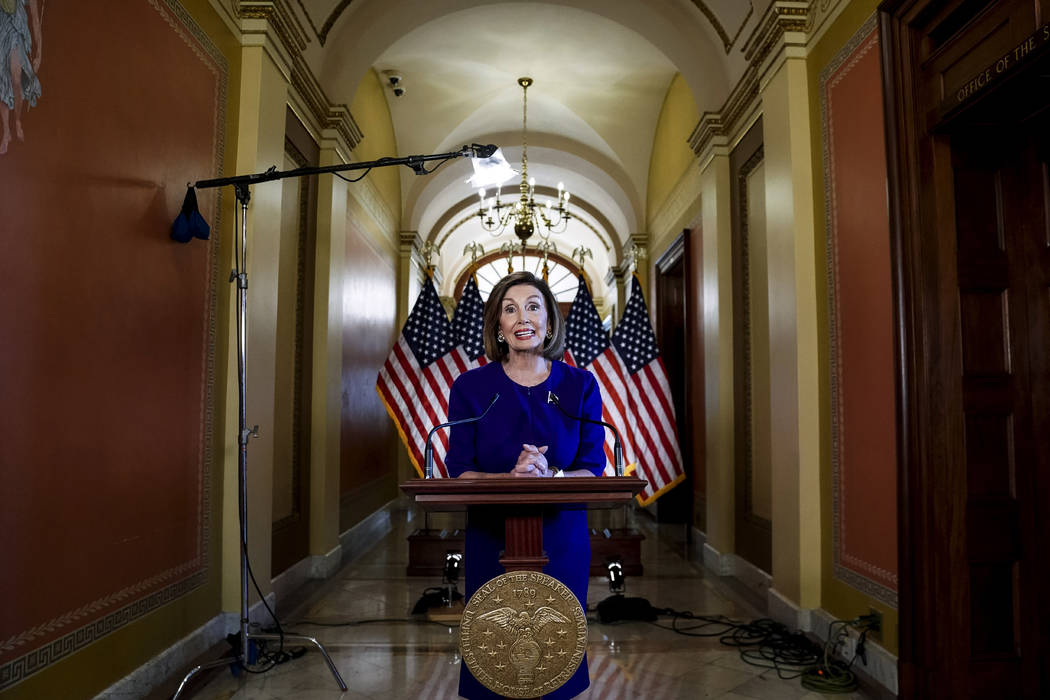 House Speaker Nancy Pelosi of Calif., reads a statement announcing a formal impeachment inquiry ...