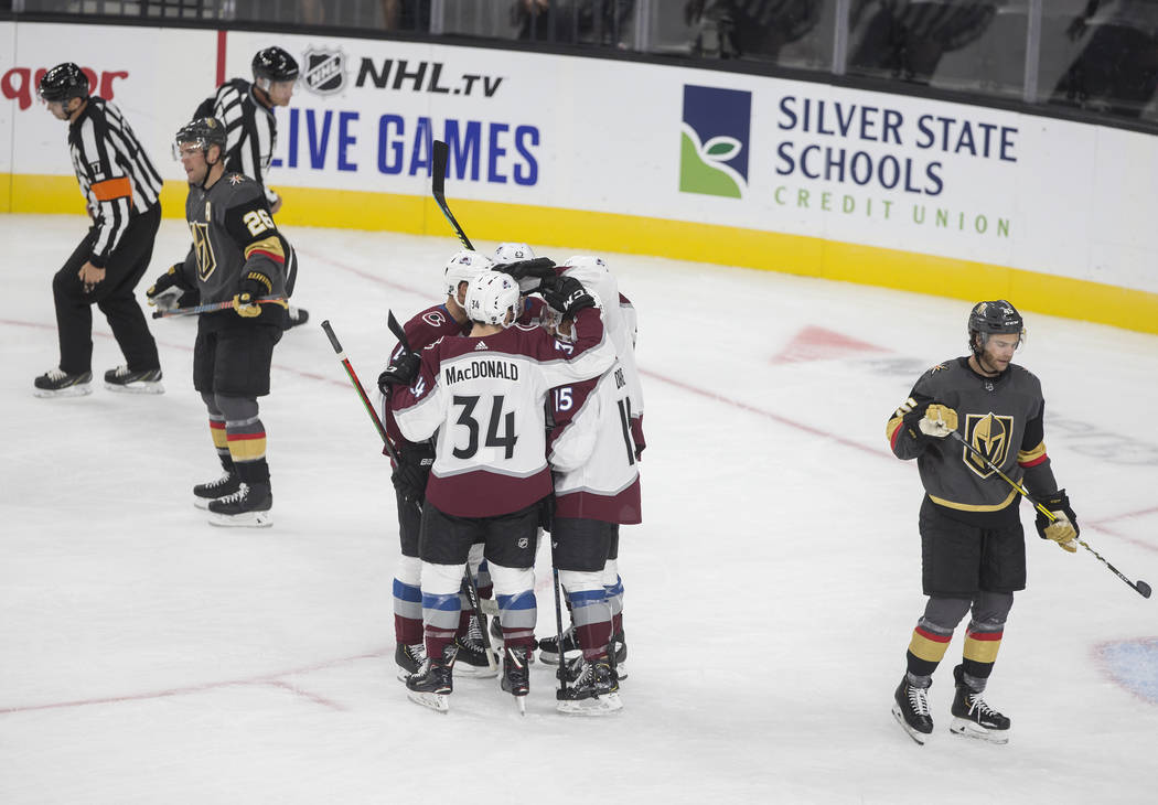 Colorado Avalanche defenseman Jacob MacDonald (34) celebrates with teammates after Colorado Ava ...