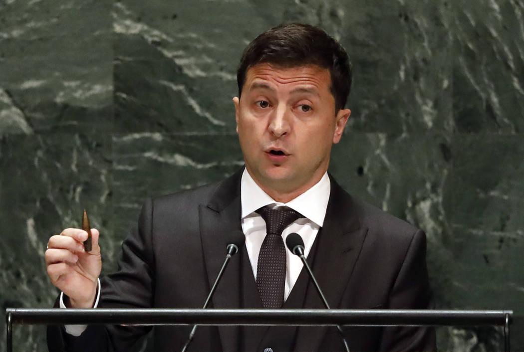 Ukraine's President Volodymyr Zelenskiy holds a bullet as he addresses the 74th session of the ...