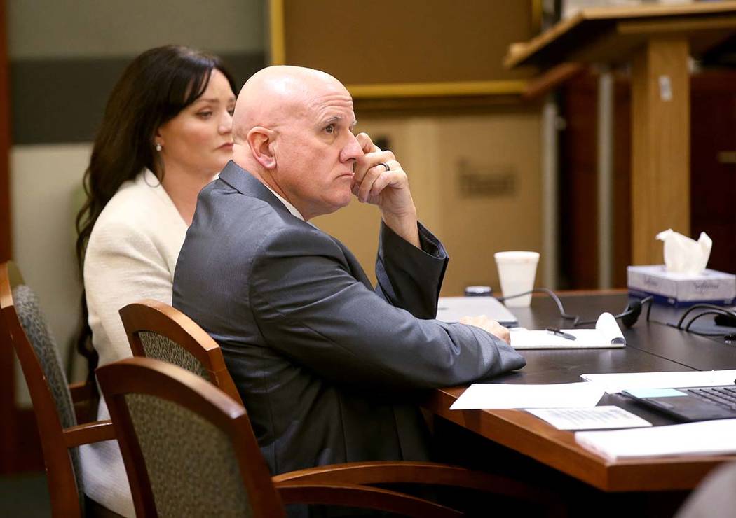 Las Vegas police Lt. James "Tom" Melton listens to closing arguments with one of his ...