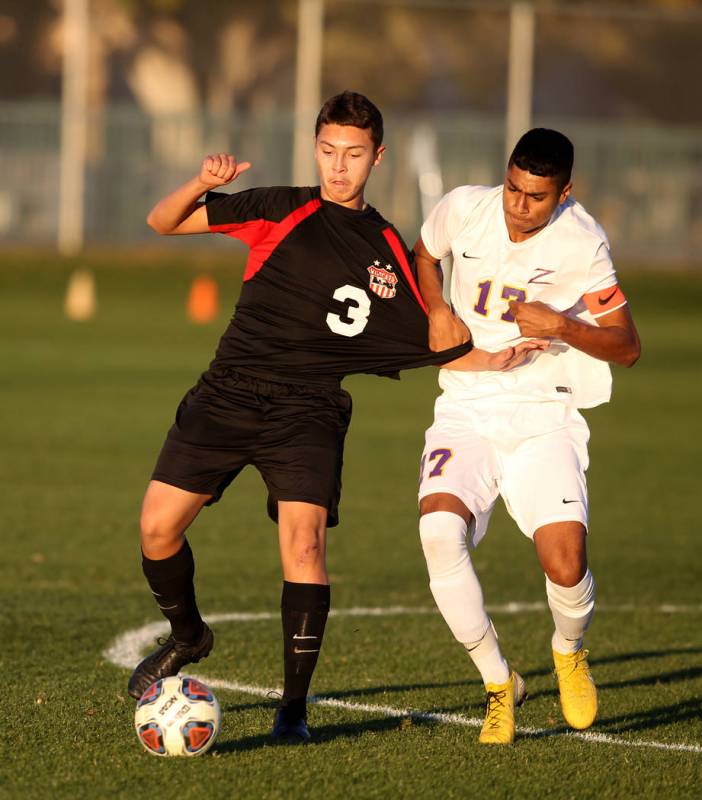 Las Vegas' Carlos Sanchez (3) and Durango's Marcos Delgado (17) battle for the ball in the firs ...