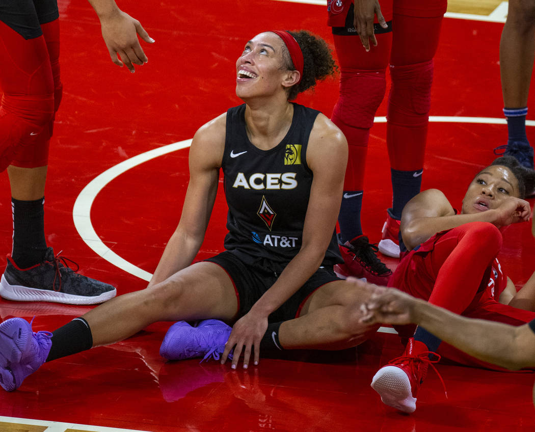 Las Vegas Aces forward Dearica Hamby (5, left) laughs after a foul from Washington Mystics forw ...
