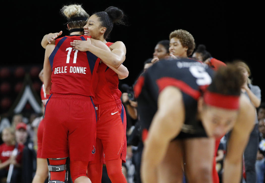 Washington Mystics' Elena Delle Donne, left, and Aerial Powers celebrate after defeating the La ...