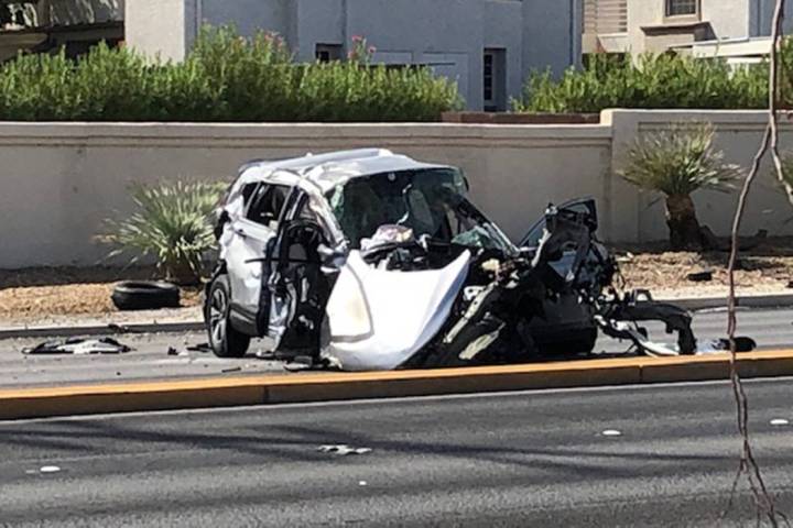 Police investigate a fatal crash near West Cheyenne Avenue and Buffalo Drive in Las Vegas, Sund ...