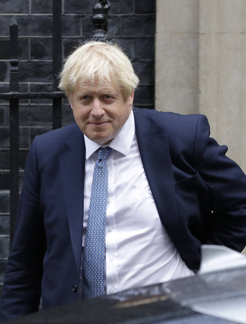 Britain's Prime Minister Boris Johnson leaves 10 Downing Street in London, Thursday, Sept. 26, ...