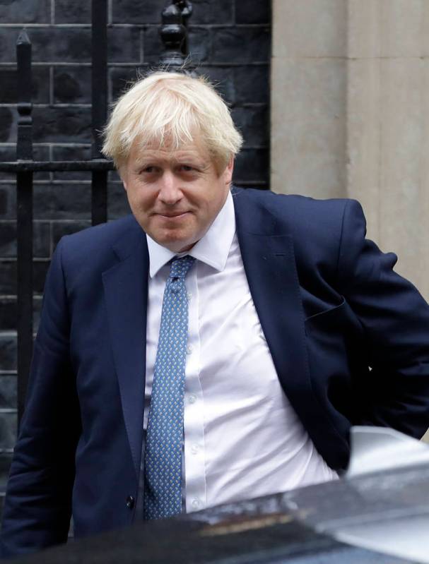 Britain's Prime Minister Boris Johnson leaves 10 Downing Street in London, Thursday, Sept. 26, ...