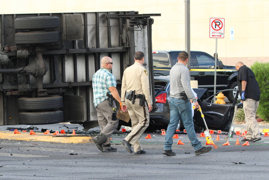 Las Vegas police investigate fatal crash involving two cars and a box truck at East Tropicana A ...