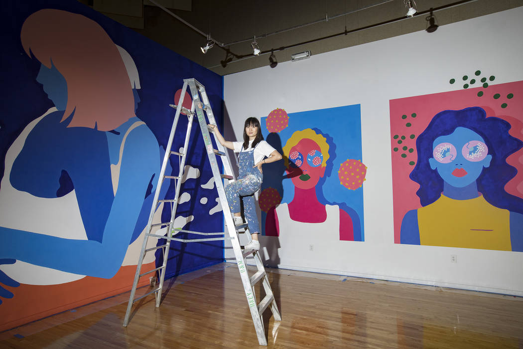 Amanda Phingbodhipakkiya, a neuroscientist-turned-artist, stands in front of her work at her ex ...