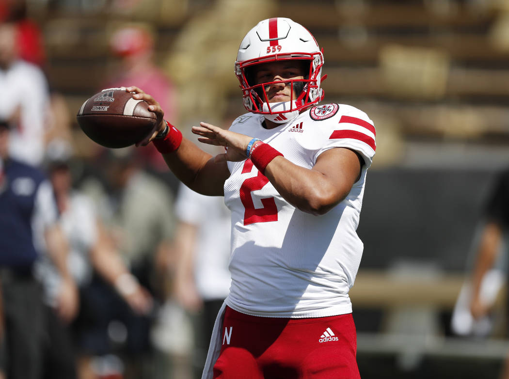 Nebraska quarterback Adrian Martinez warms up before an NCAA college football game against Col ...