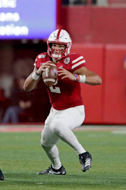 Nebraska quarterback Adrian Martinez (2) scrambles during the second half of an NCAA college fo ...