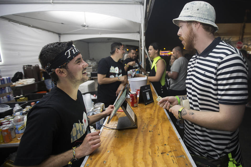 Luca Iclodean, left, takes a customer's drink order at Life is Beautiful on Friday, Sept. 20, 2 ...