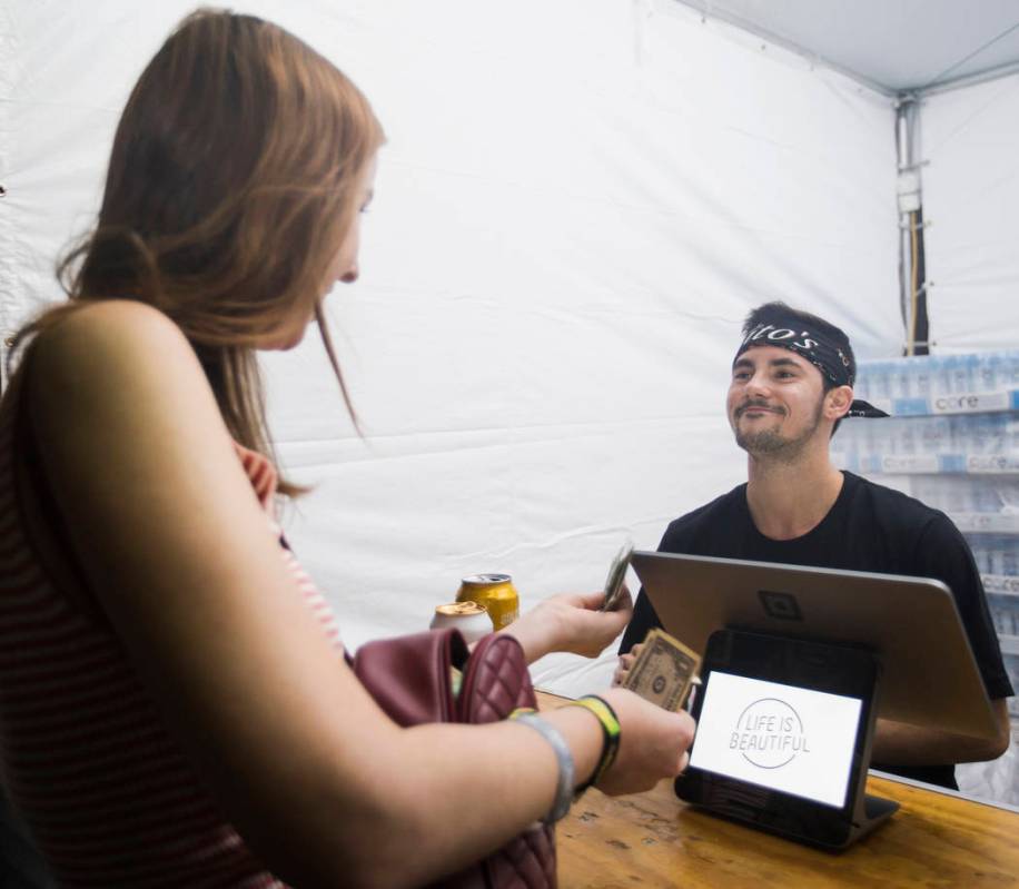 Luca Iclodean, right, takes a customer's drink order at Life is Beautiful on Friday, Sept. 20, ...