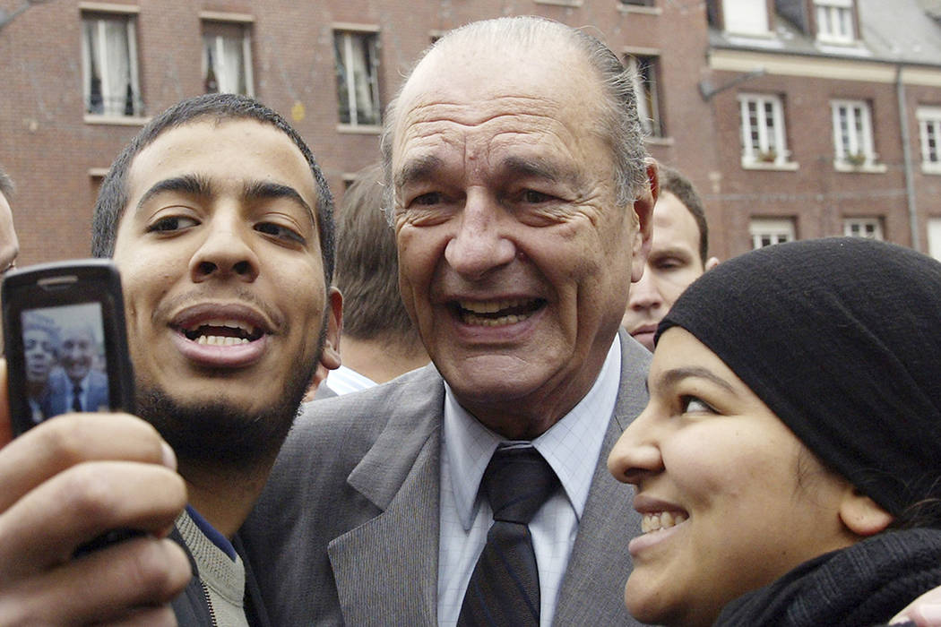 FILE - In this Nov.14, 2006 file photo, French President Jacques Chirac poses with residents du ...