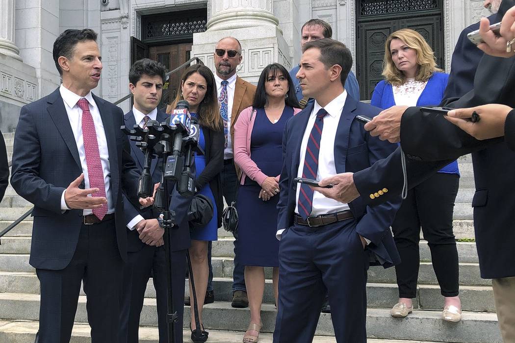 Attorneys Joshua Koskoff, left, and Christopher Mattei, right, representing parents, rear, of c ...