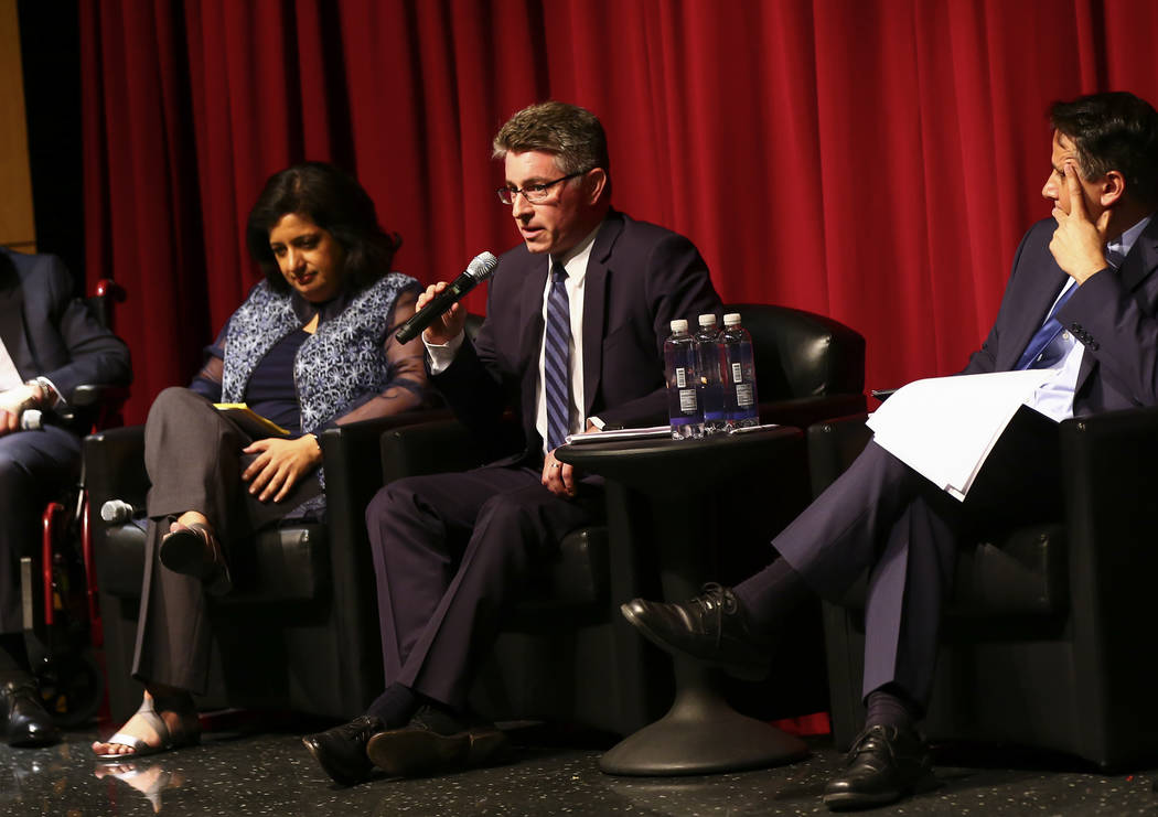 Michael Kagan, professor at UNLV's Boyd School of Law, center, speaks during a panel about Isla ...