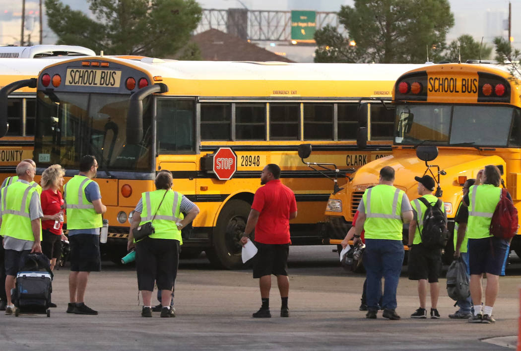 In this Aug. 12, 2019, file photo, the Clark County School District's (CCSD) bus drivers arrive ...