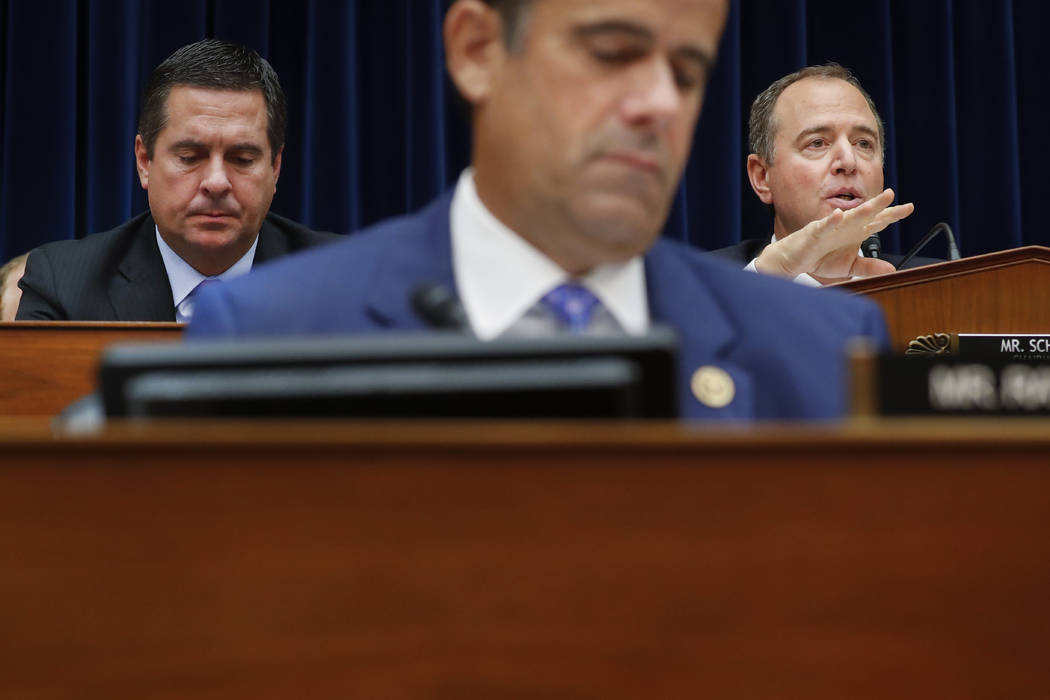 Chairman Rep. Adam Schiff, D-Calif., right, questions Acting Director of National Intelligence ...