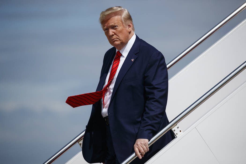 President Donald Trump steps off Air Force One after arriving at Andrews Air Force Base, Thursd ...