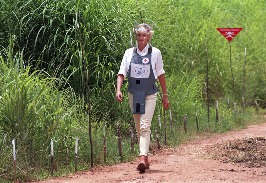 FILE - In this Jan. 15, 1997 file photo, Princess Diana, wearing a bombproof visor, visits a mi ...