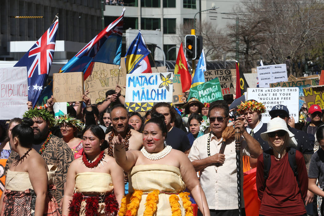 Thousands of people march on Parliament to protest climate change in Wellington, New Zealand, F ...