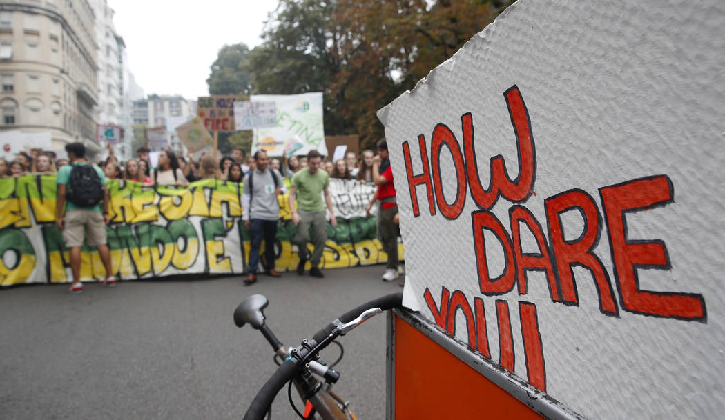 Students demonstrate during a worldwide protest demanding action on climate change in Milan, It ...