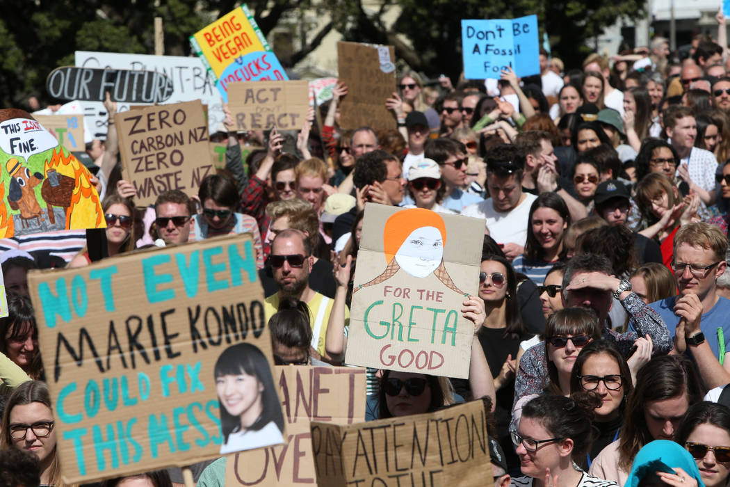 Thousands of people march on Parliament to protest climate change in Wellington, New Zealand, F ...