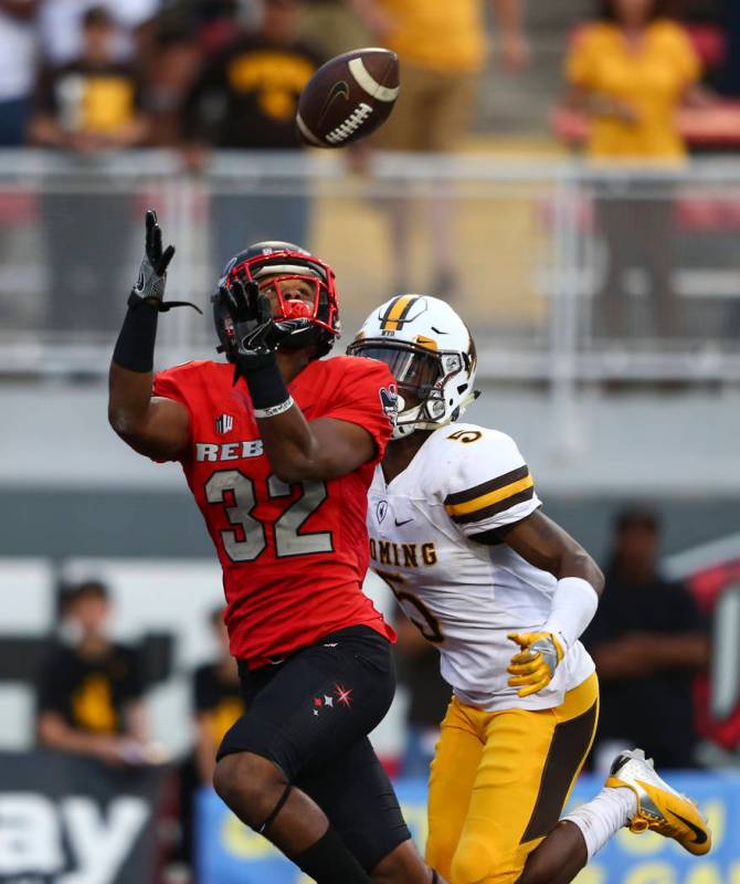 UNLV defensive back Jericho Flowers (32) receives a pass in the end zone to score a touchdown d ...