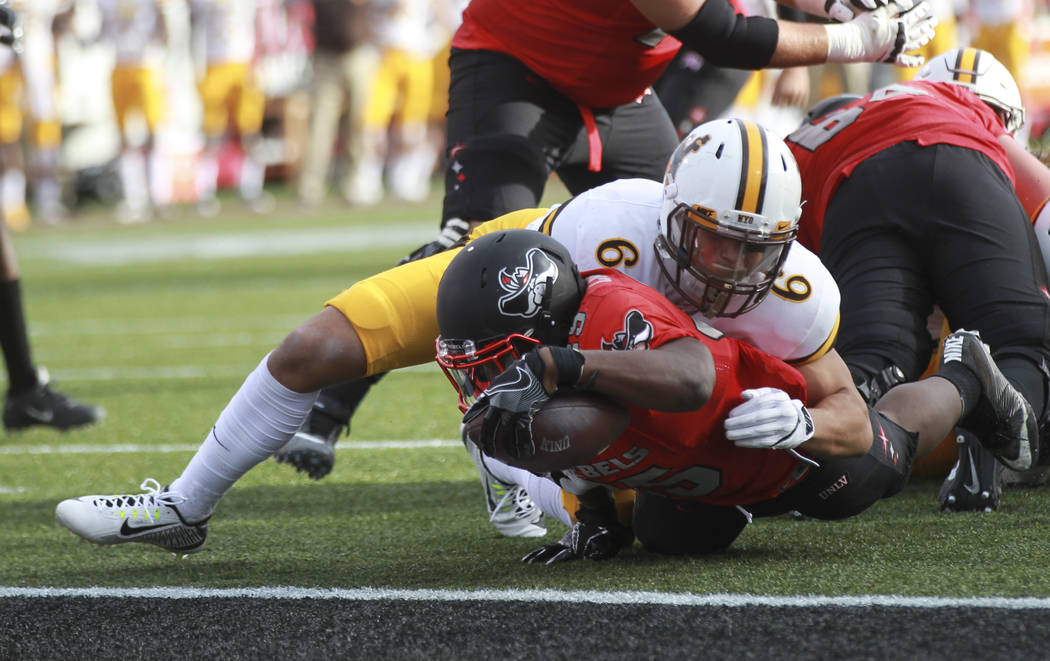 UNLV running back Xzaviar Campbell (35) comes up short at the end zone during a football game a ...