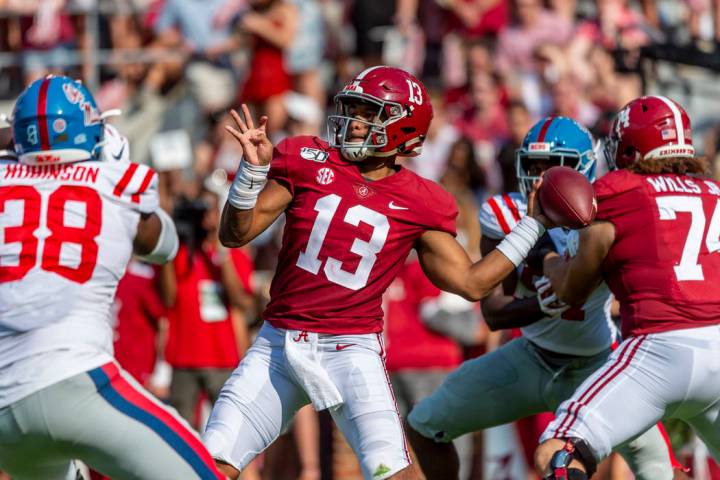 Alabama quarterback Tua Tagovailoa (13) throws long during the first half of an NCAA college fo ...