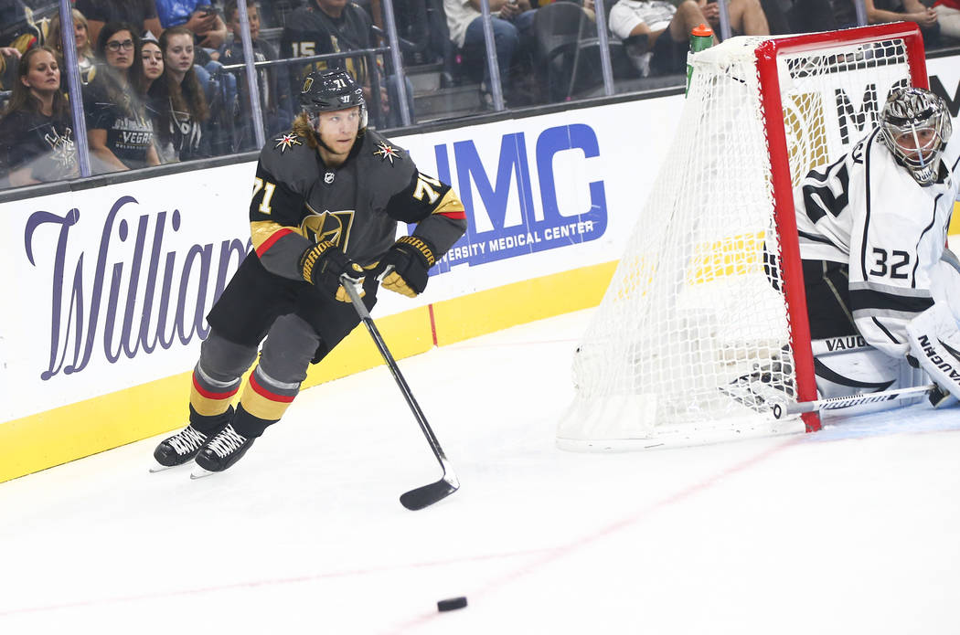 Golden Knights' William Karlsson (71) chases after the puck as Los Angeles Kings goaltender Jon ...