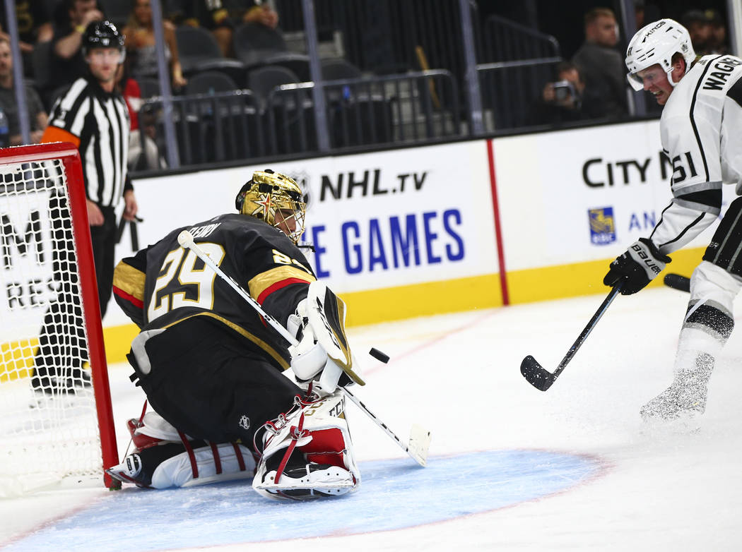 Golden Knights goaltender Marc-Andre Fleury (29) blocks a shot from Los Angeles Kings' Austin W ...