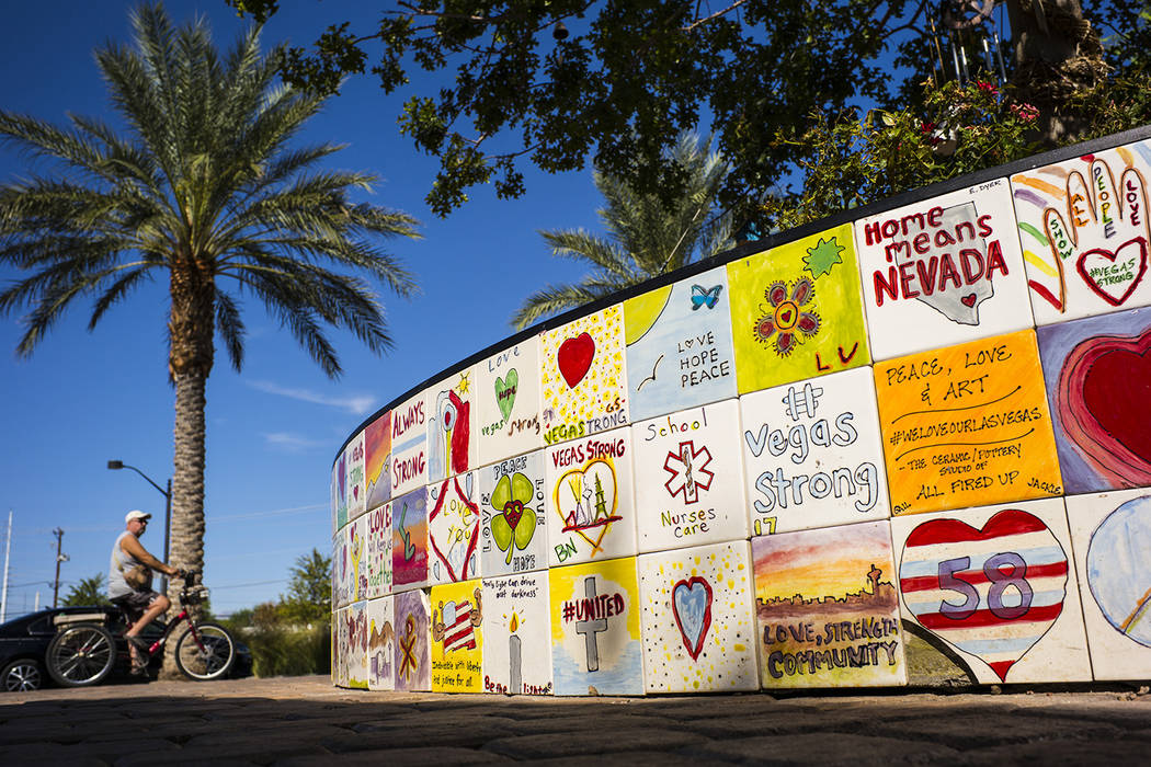 A view of tile mosaics that create a heart shaped planter box which surrounds the tree of life ...